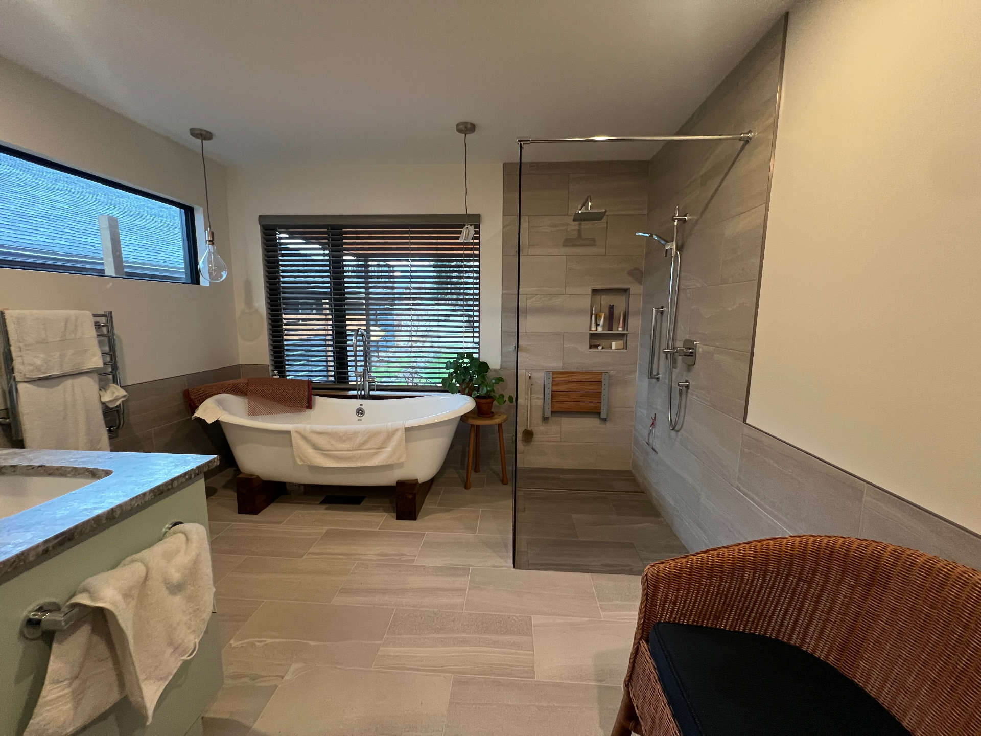 Spa-like bathroom with freestanding tub and glass-enclosed walk-in shower